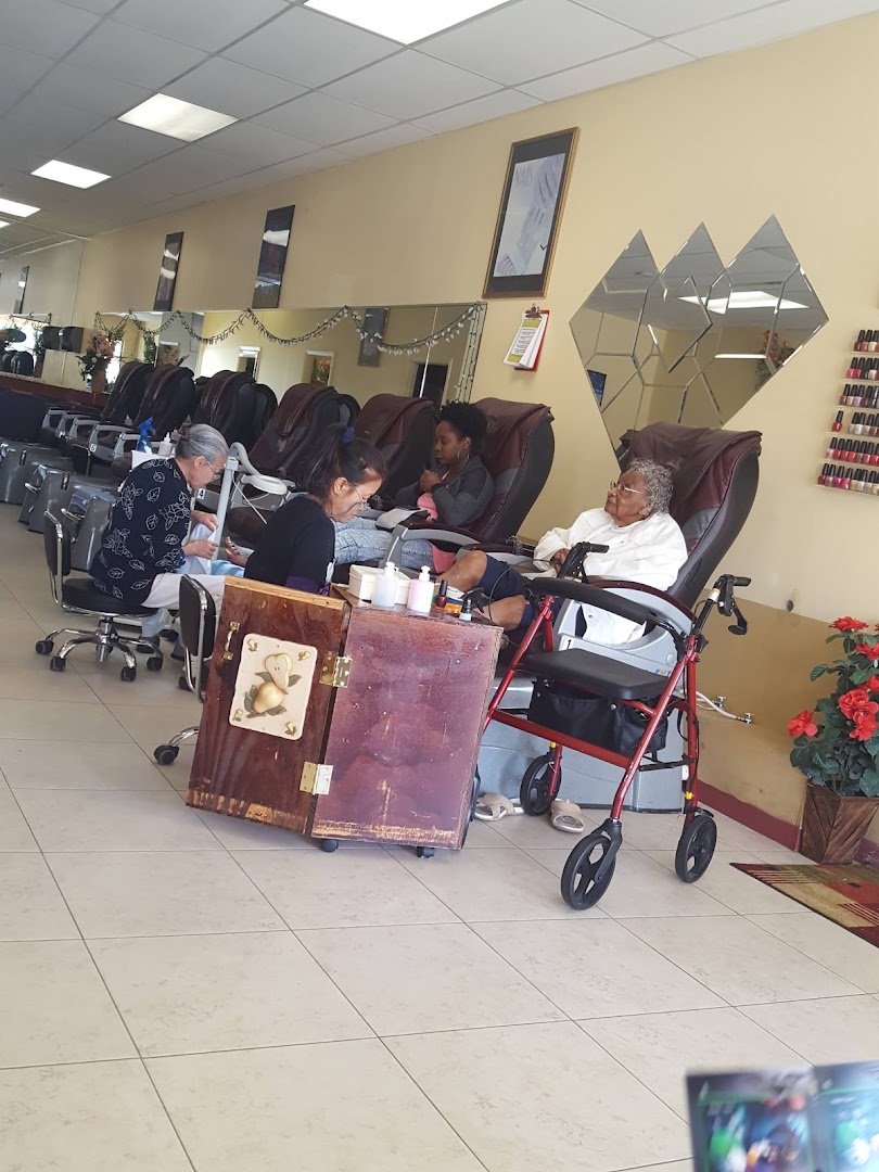 Nail salon interior with manicure stations.